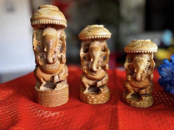 Hand Carved Ganesha with Umbrella Wooden Idol