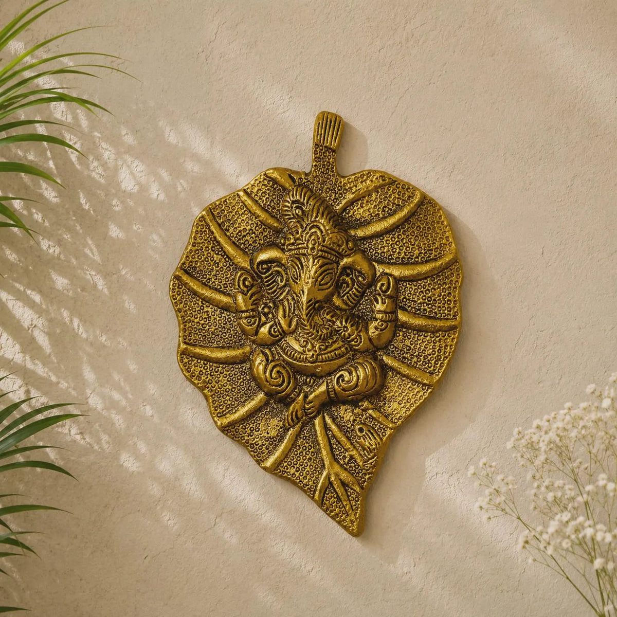 Handcrafted Ganesh Ji Wall Decor
Antique Metal Wall Art
Indian Spiritual Decoration
Leaf Shaped Ganesh Ji Hanging
Traditional Artisan Design
Uphar Handicrafts