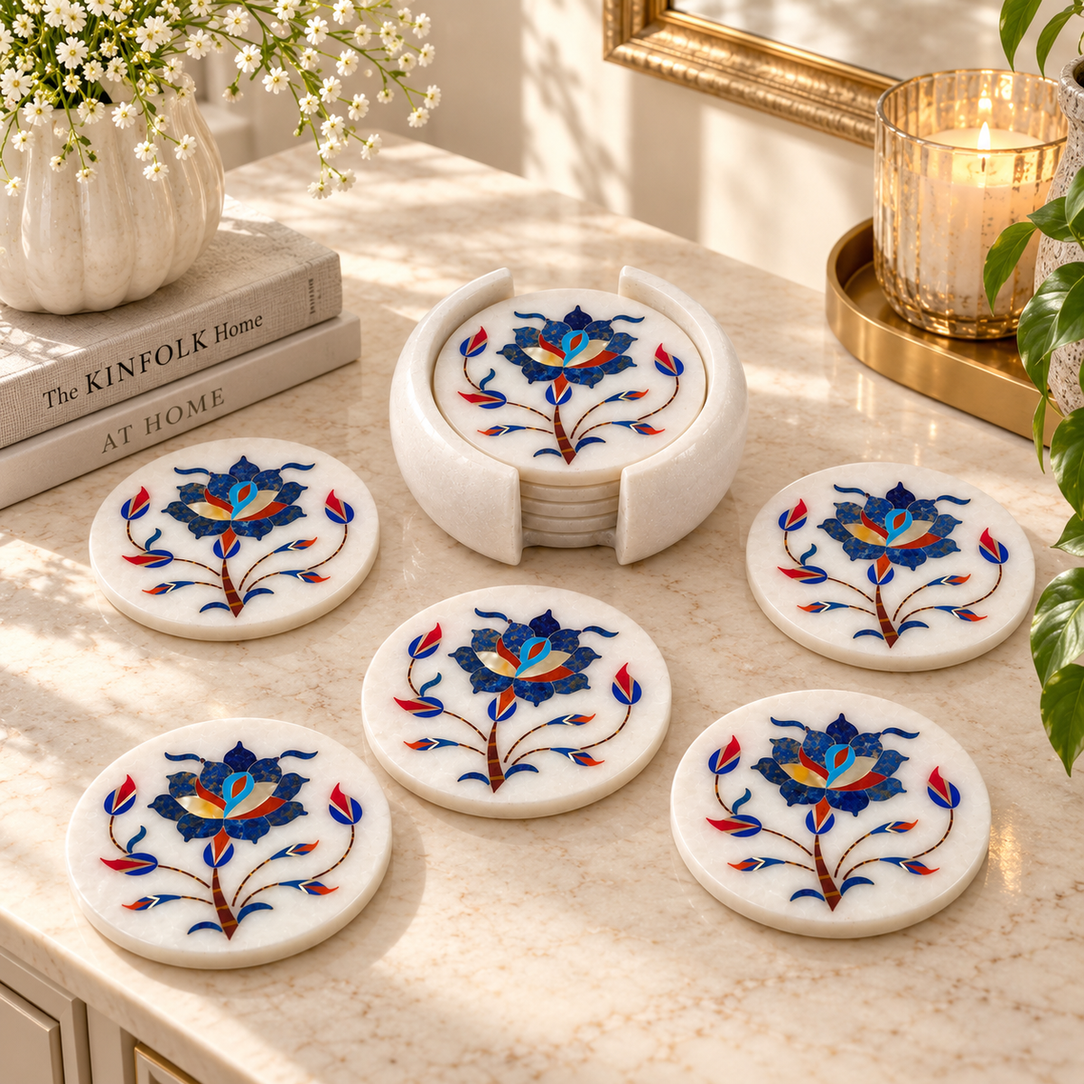 Blue floral inlay marble coasters
Set of 6 round coasters with holder
White marble coaster set
Floral vine inlay pattern
Hand-finished marble table decor
Traditional Mughal-inspired design
Uphar Handicrafts