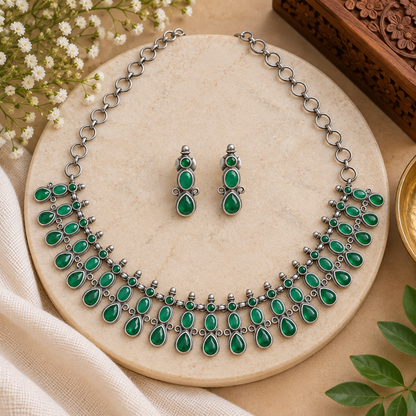Boho tribal necklace and earrings set
Traditional Indian-inspired oxidized jewelry
Antique silver-tone metal alloy finish
Handcrafted necklace with stone and bead accents
Matching earrings for ethnic and bohemian looks
Suitable for festivals, parties and cultural events
Uphar Handicrafts