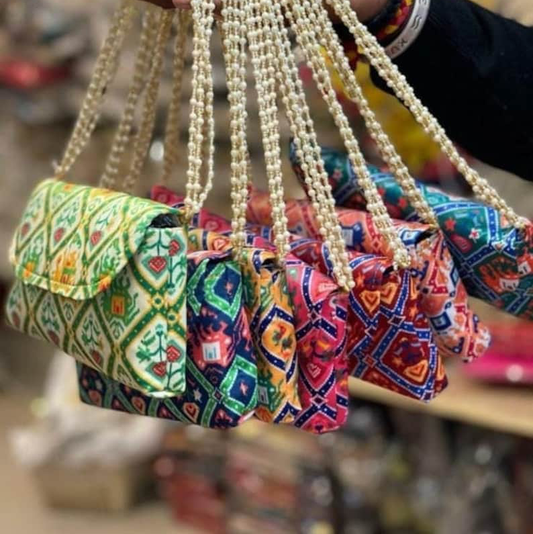 Designer Patola Hand Clutch with Handle
Traditional Indian Wedding Hand Bag
Patola Print Return Gift
Wedding Favor and Giveaway Bag
Stylish Indian Hand Clutch
Uphar Handicrafts