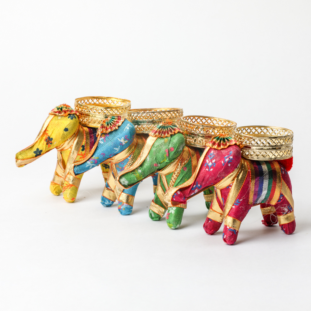 Fabric Elephant Candle Decor
Traditional Elephant Inspired Craft
Handmade Fabric Tealight Holder
Decorative Tabletop Candle Accent
Indian Ethnic Home Decoration
Festive Pooja and Living Room Decor
Uphar Handicrafts