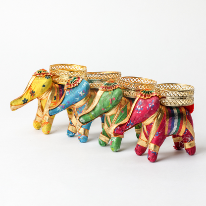 Fabric Elephant Candle Decor
Traditional Elephant Inspired Craft
Handmade Fabric Tealight Holder
Decorative Tabletop Candle Accent
Indian Ethnic Home Decoration
Festive Pooja and Living Room Decor
Uphar Handicrafts
