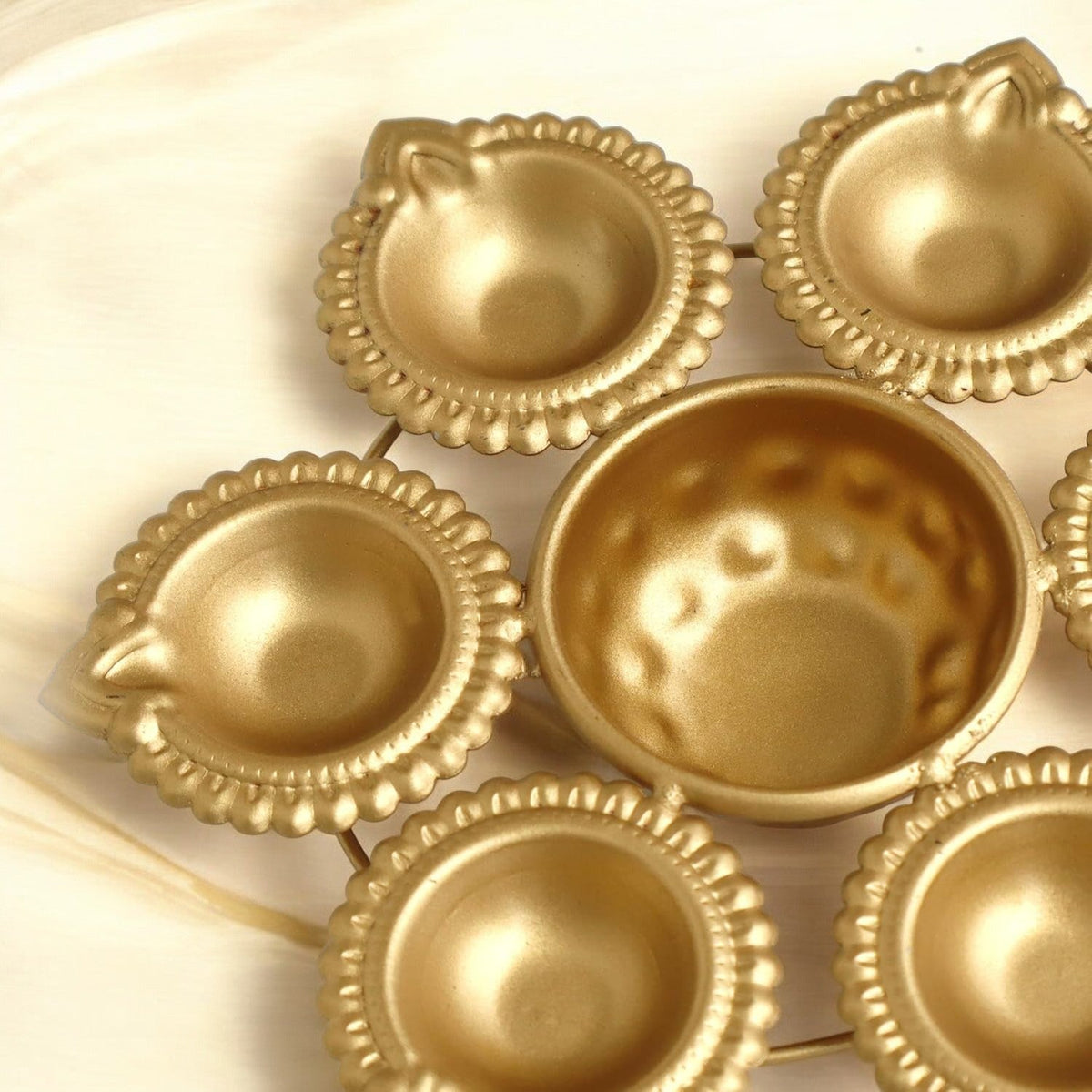 Floral Golden Urli Diya Centerpiece
Traditional Indian Flower Bowl Design
Elegant Metal Golden Finish
Decorative Tabletop Urli
Diwali Pooja and Wedding Decoration
Coffee Table Altar and Festive Centerpiece
Uphar Handicrafts