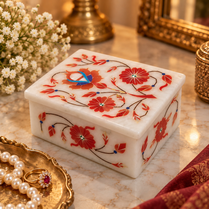 Floral marble trinket storage box
White marble with hand-inlaid motifs
Decorative leaf and vine pattern
Rectangular design with a lid
Traditional Mughal-inspired artwork
Handcrafted small storage accessory
Uphar Handicrafts