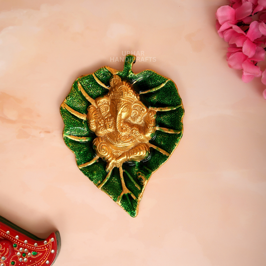 Divine Ganesh Ji on Leaf Design
Green and Golden Metal Ganesha Decor
Handcrafted Indian Spiritual Wall Art
7x5 Inch Ganesh Home Decoration
Pooja Room and Mandir Decor
Uphar Handicrafts