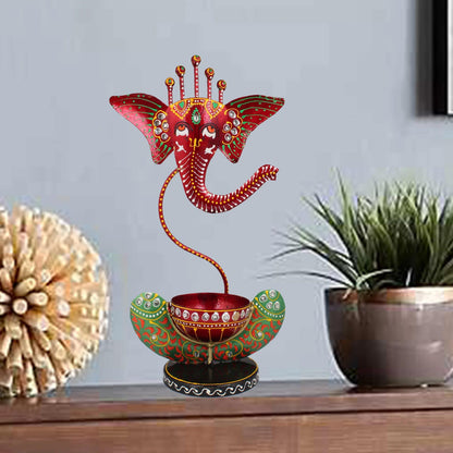 Lord Ganesh Ji Metal Tealight Holder
Hand Painted Ganesh Diya Lamp
Black and Green Iron Diya
12 Inch Ganesh Home Decor
Diwali and Festival Decoration
Uphar Handicrafts