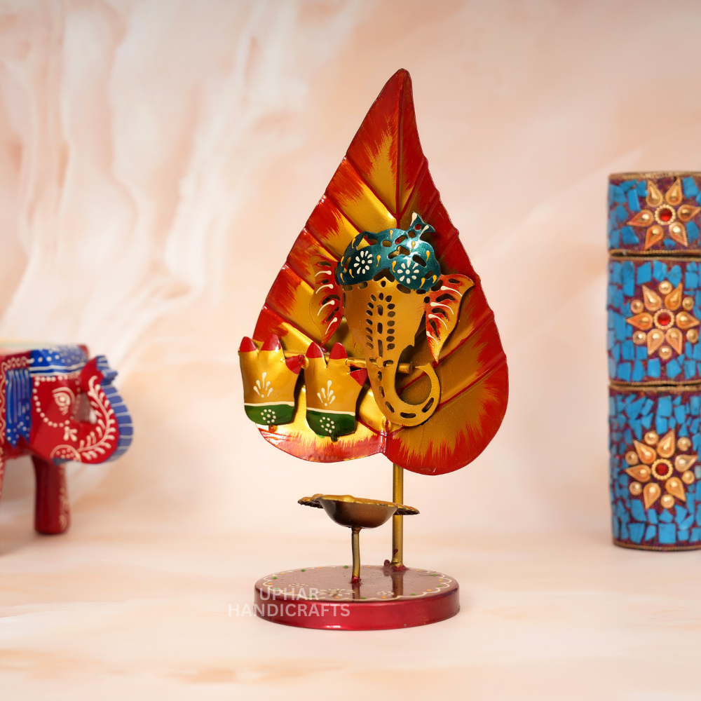 Ganesh Ji Pan Patta Diya Holder
Vibrant Hand-Painted Metal Decor
Festive Yellow Orange and Red Finish
Traditional Indian Pooja Accessory
Diwali Centerpiece and Temple Decor
Indian Spiritual Gift for Home
Uphar Handicrafts