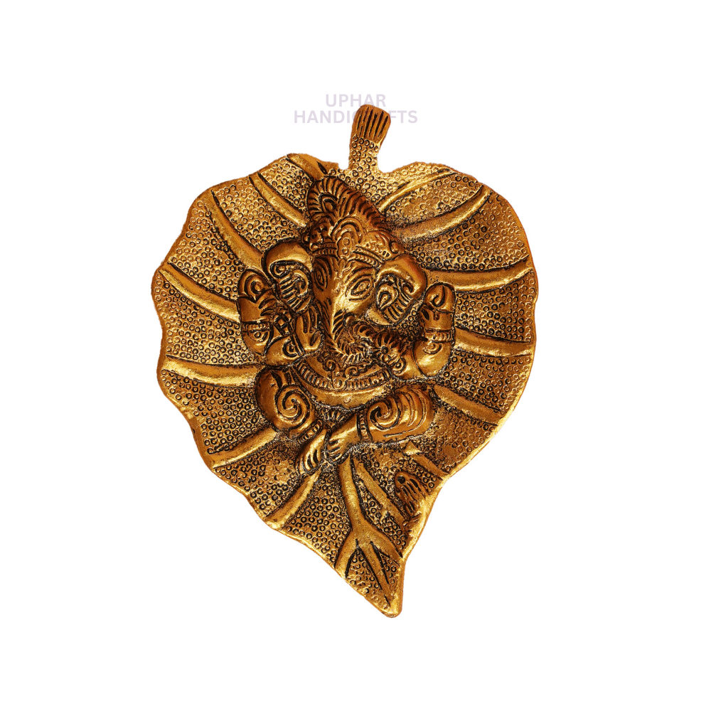 Ganesh Sacred Leaf Golden Metal Decor
Embossed Lord Ganesha Wall Art
Traditional Indian Spiritual Decoration
Pooja and Entryway Home Decor
Housewarming and Wedding Gift
Uphar Handicrafts