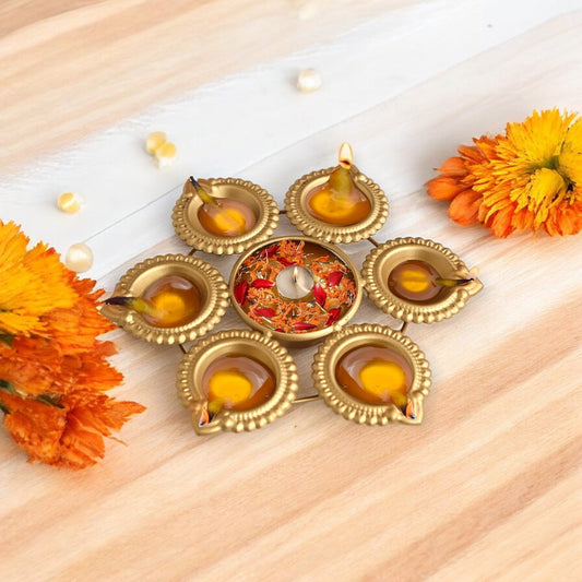 Golden Floral Metal Urli Bowl Diya
Intricate Flower Shape Decorative Design
Glossy Golden Metallic Finish
Diameter Indian Urli Bowl
Floating Diya and Candle Holder
Diwali Wedding and Festive Home Decor
Uphar Handicrafts