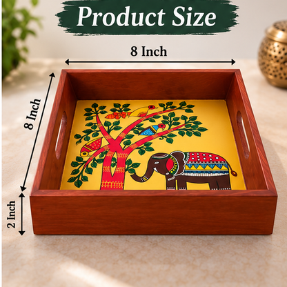 Hand-painted wooden tray featuring traditional elephant and tree artwork
Square serving tray with a polished wooden frame
Folk art centerpiece with cut-out handles on both sides
Handcrafted Indian-inspired tray measuring approximately 8 × 8 inches
Suitable for birthdays, weddings, anniversaries and housewarming gifts
Each tray may feature slight variations in color and painted details
Uphar Handicrafts