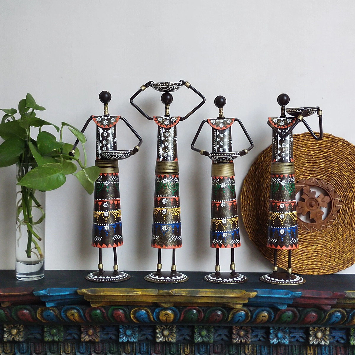Handcrafted Iron Tribal Doll Candle Holders
Set of 4 Tealight Candle Stands
Intricate Tribal Inspired Figure Design
Bold Colorful Iron Home Decor
Global Inspired Tabletop Decoration
Warm Candlelight and Ethnic Home Accent
Uphar Handicrafts