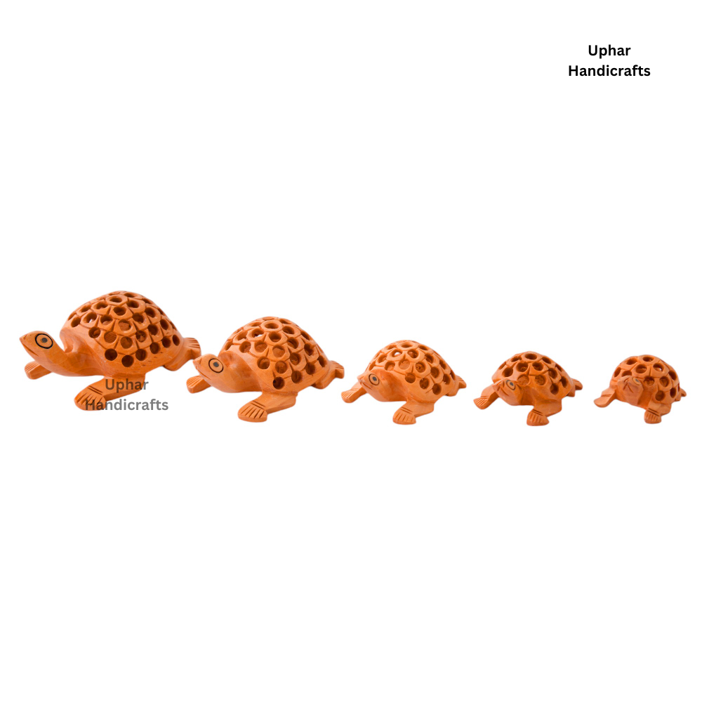 Handcrafted Wooden Tortoise Set of 5
Natural Wood Traditional Craft
Intricate Artisan Carved Detailing
Symbolic Tortoise Home Decor
Spiritual Tabletop and Shelf Accent
Festive Gift and Cultural Decor
Uphar Handicrafts