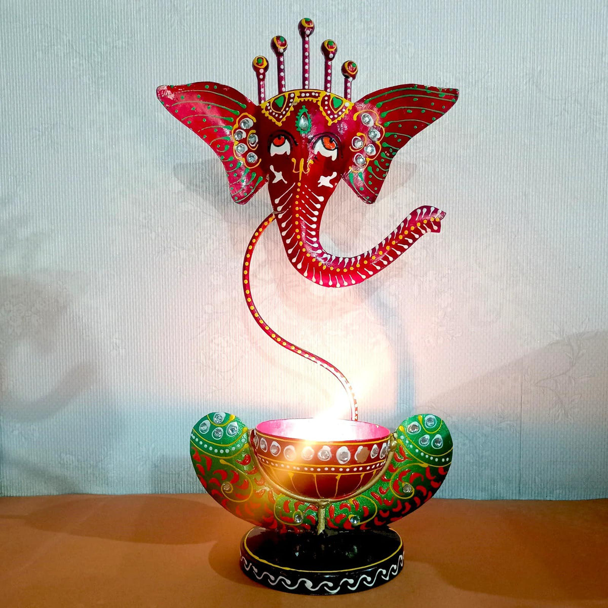 Hand Painted Ganesh Metal Diya
Iron Ganesh Tealight Holder
Black Green Indian Handicraft
Decorative Ganesh Lamp for Home
Diwali and Festival Pooja Decor
Uphar Handicrafts