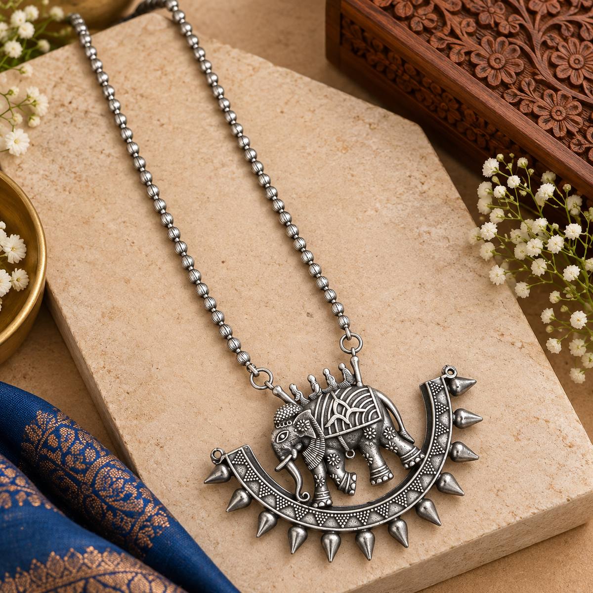 Indian boho-style oxidized necklace and earrings
Traditional tribal-inspired jewelry design
Antique silver-tone metal alloy finish
Decorative stones and beads on handcrafted jewelry
Adjustable black thread tie-back closure
Suitable for Garba, festivals and boho outfits
Uphar Handicrafts