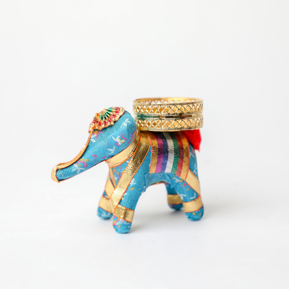 Indian Fabric Elephant Tealight Holder
Handcrafted Traditional Elephant Design
Decorative Fabric Home Accent
Tealight Candle Stand for Tabletop
Ethnic Indian Room Decoration
Festive and Spiritual Home Decor
Uphar Handicrafts