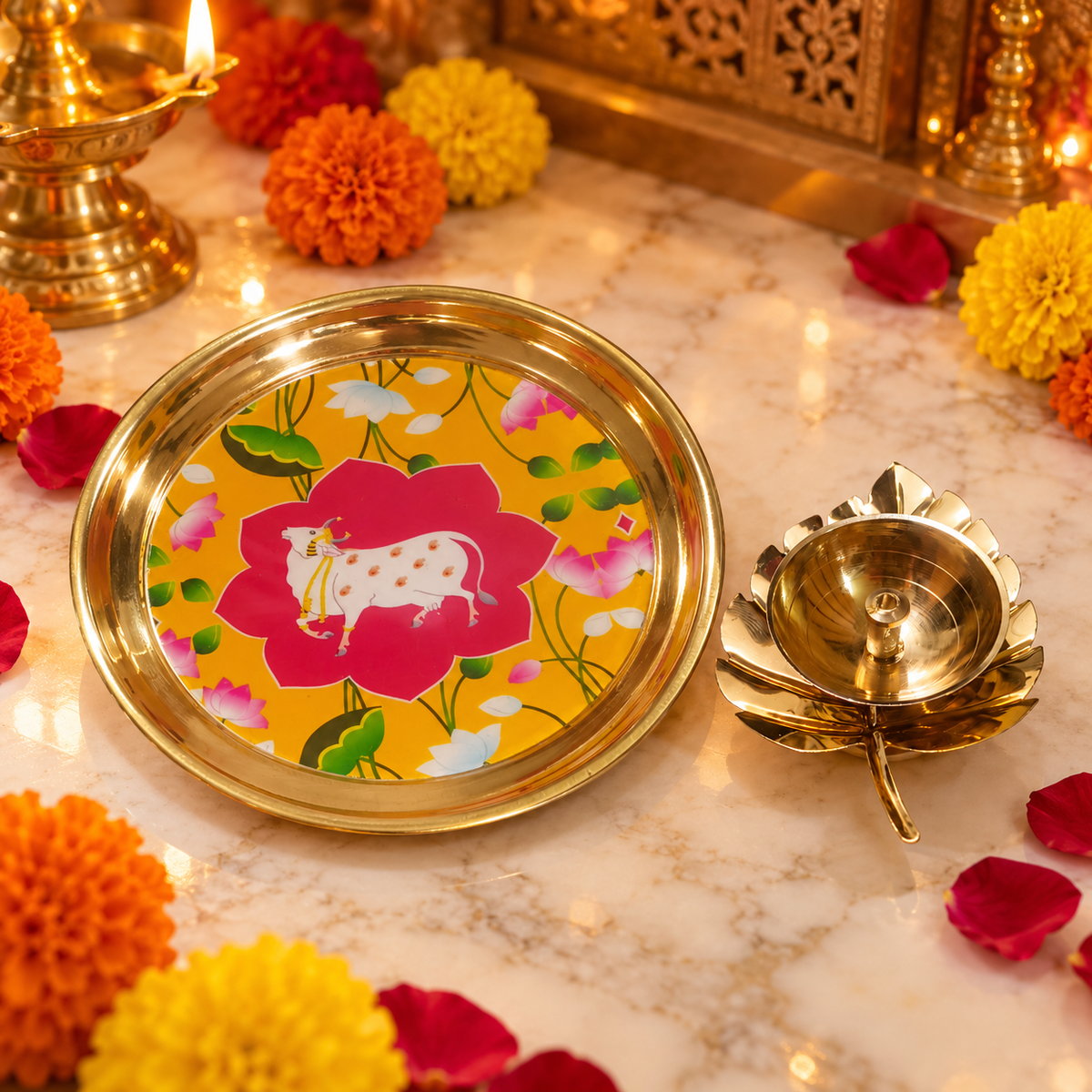 Indian festival puja accessories in polished brass
Decorative plate with cow and floral artwork
Lotus-shaped diya accompanies the round plate
Traditional design inspired by Pichwai art
Suitable for Diwali and Dhanteras celebrations
Thoughtful gift for festive and religious occasions
Uphar Handicrafts