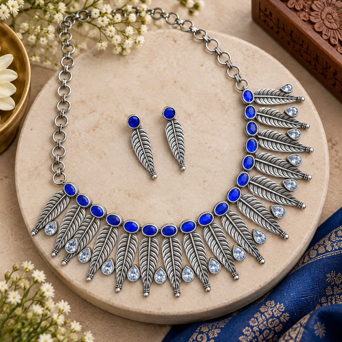 Indian tribal-style oxidized necklace and earrings
Traditional handcrafted jewelry set with antique finish
Metal alloy necklace with decorative stone accents
Matching earrings with bead detailing
Boho-inspired jewelry for ethnic and festive wear
Necklace set for parties, weddings and celebrations
Uphar Handicrafts
