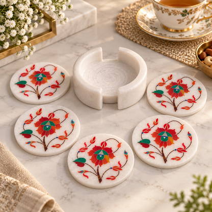 Marble coaster holder with matching coasters
Set of 6 white marble coasters
Hand-inlaid floral motif design
Approximately 4 cm stack height with holder
Handcrafted and hand-finished marble
Traditional table decor for mugs and glasses
Uphar Handicrafts