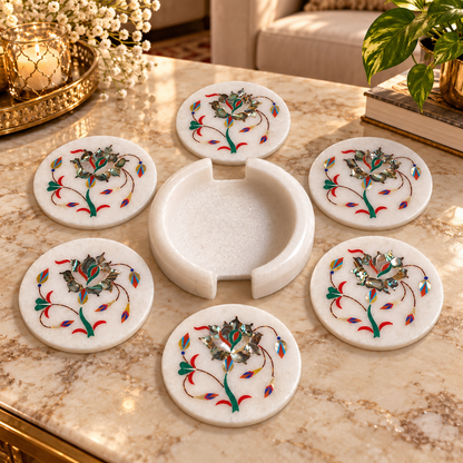 Marble coaster holder with matching coasters
Set of 6 white marble coasters
Hand-inlaid floral motif design
Approximately 4 cm stack height with holder
Handcrafted and hand-finished marble
Traditional table decor for mugs and glasses
Uphar Handicrafts