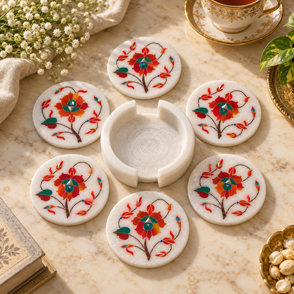 Marble coaster set with matching holder
Set of 6 round white marble coasters
Hand-inlaid floral vine pattern
Polished white marble finish
Traditional Mughal-inspired table decor
Handcrafted and hand-finished coaster set
Uphar Handicrafts
