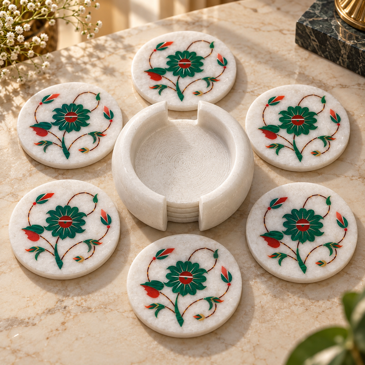 Marble coaster set with matching holder
Set of 6 round white marble coasters
Hand-inlaid floral vine pattern
Polished white marble finish
Traditional Mughal-inspired table decor
Handcrafted and hand-finished coaster set
Uphar Handicrafts