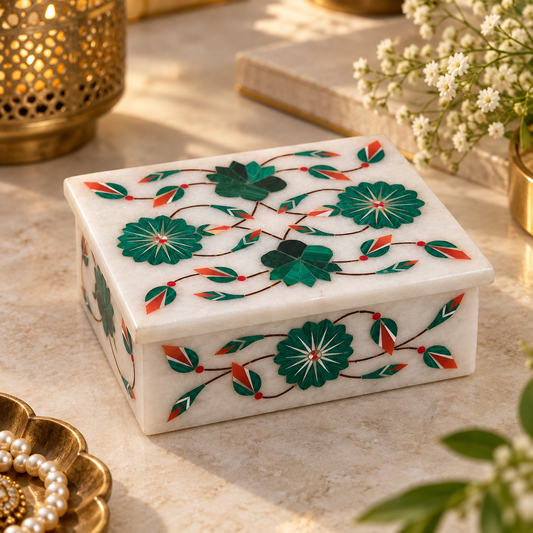 Marble inlay jewelry and trinket box
White marble box with matching lid
Hand-inlaid floral motifs
Polished marble finish
Traditional Mughal-inspired craftsmanship
Handcrafted Indian decorative storage box
Uphar Handicrafts