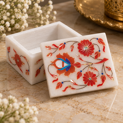 Marble ring and coin storage box
White marble rectangular trinket box
Hand-inlaid floral motifs
Polished marble surface with lid
Traditional Mughal-inspired design
Suitable for coins and small keepsakes
Uphar Handicrafts