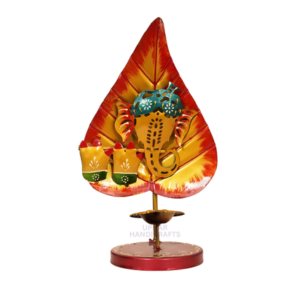 Metal Ganesh Ji Leaf Diya Tealight
Hand-Decorated Pan Patta Design
Colorful Enamel Traditional Artwork
Gold Tone Tea Light Holder
Indian Festival and Pooja Decoration
Diwali Housewarming and Wedding Gift
Uphar Handicrafts