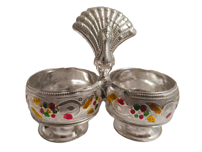 Metal Peacock Kumkum Holder
Handcrafted Indian Puja Accessory
Two Compartment Roli Chawal Holder
Embossed Floral and Enamel Detailing
Traditional Hindu Ritual Decoration
Festive and Wedding Gift Idea
Uphar Handicrafts