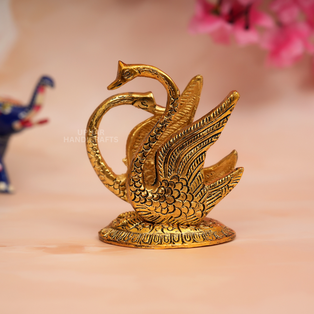 Metal Swan Tissue Holder
Unique Swan Shaped Napkin Organizer
Shiny Golden Metallic Finish
Red Accent Indian Home Decor
Dining Table and Kitchen Counter Accessory
Elegant Festive Tabletop Decoration
Uphar Handicrafts