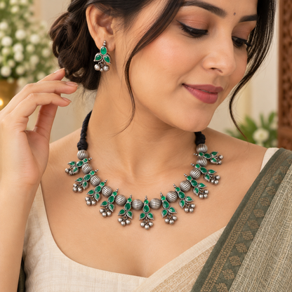 Oxidized necklace and earrings for Navratri Garba
Traditional Indian-inspired tribal jewelry
Antique silver-tone handcrafted metal alloy set
Decorative stone and bead accents
Matching earrings for festive ethnic outfits
Jewelry for Garba, cultural events and celebrations
Uphar Handicrafts