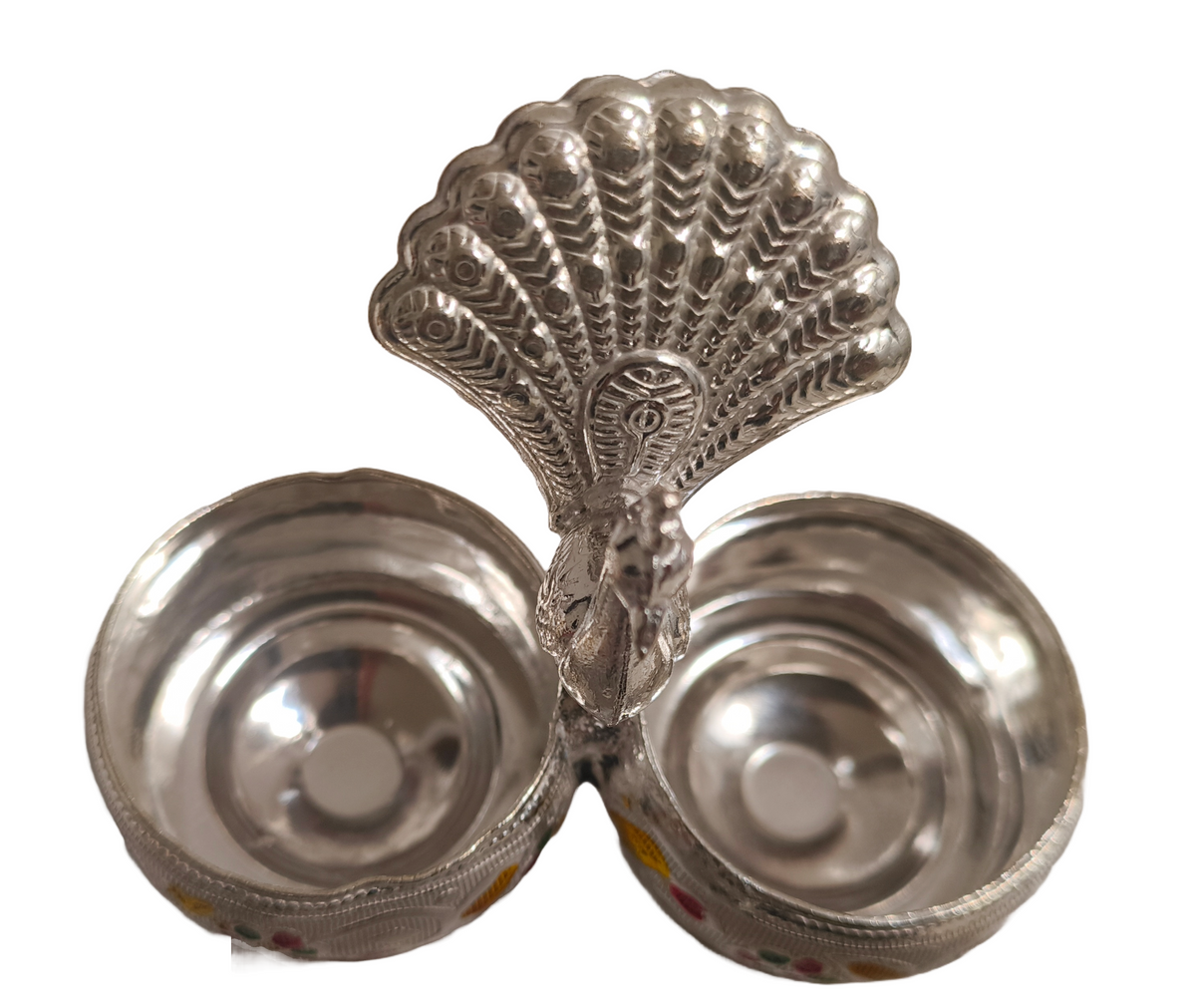 Peacock Roli Chawal Puja Holder
Silver-Toned Metal Peacock Design
Dual Bowl Kumkum and Rice Holder
Colorful Enamel Indian Artwork
Compact Home Temple Pooja Decor
Indian Wedding and Diwali Gift
Uphar Handicrafts