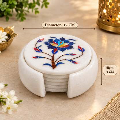 Round marble coasters with floral inlay
White marble coaster set with holder
Floral vine pattern detailing
Approximately 12 cm coaster diameter
Handcrafted and hand-finished coasters
Traditional Mughal-inspired table decor
Uphar Handicrafts