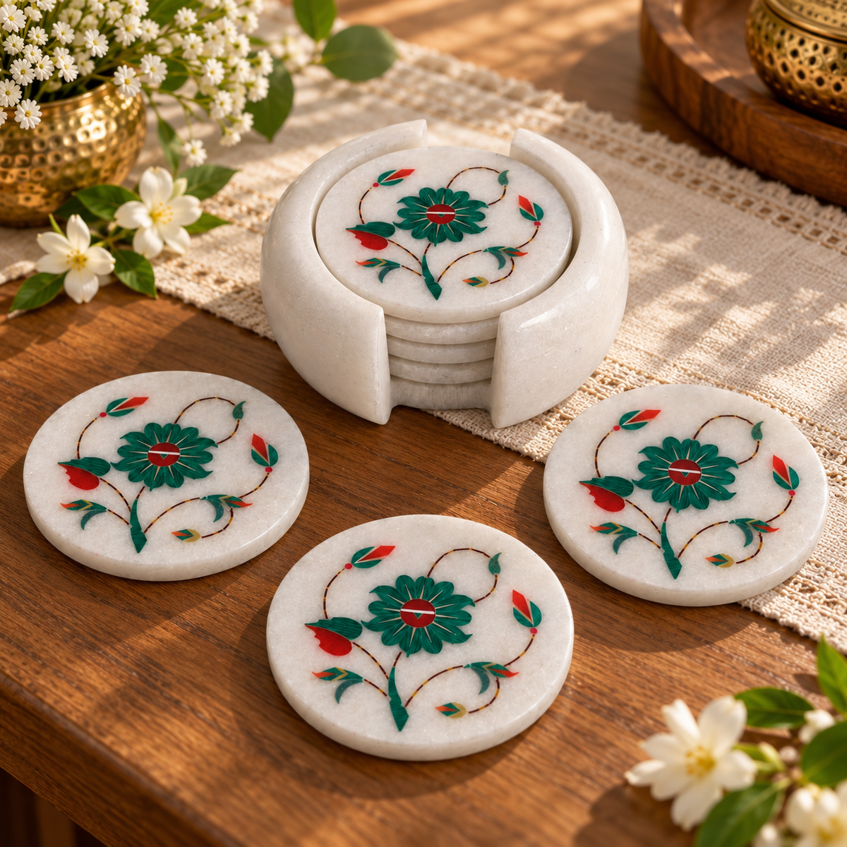 Round marble coasters with floral vine design
White marble with hand-inlaid motifs
Set of 6 coasters and 1 holder
Approximately 12 cm coaster diameter
Polished natural stone finish
Mughal-inspired home decor
Uphar Handicrafts