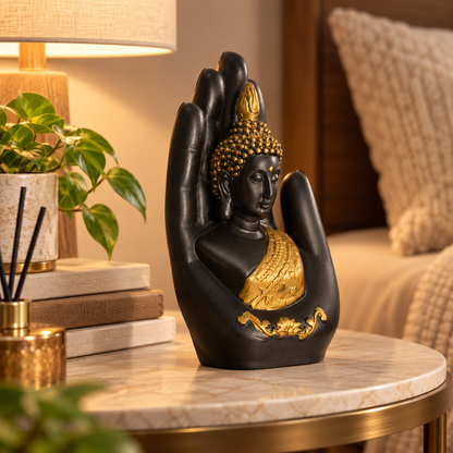 Seated Buddha figurine positioned on an open hand
Matte black statue with gold-tone decorative accents
Detailed Buddha hair and robe design
Lotus-inspired border detailing on the base
Hand-finished spiritual home decor accessory
Suitable for desks, consoles and display shelves
Uphar Handicrafts