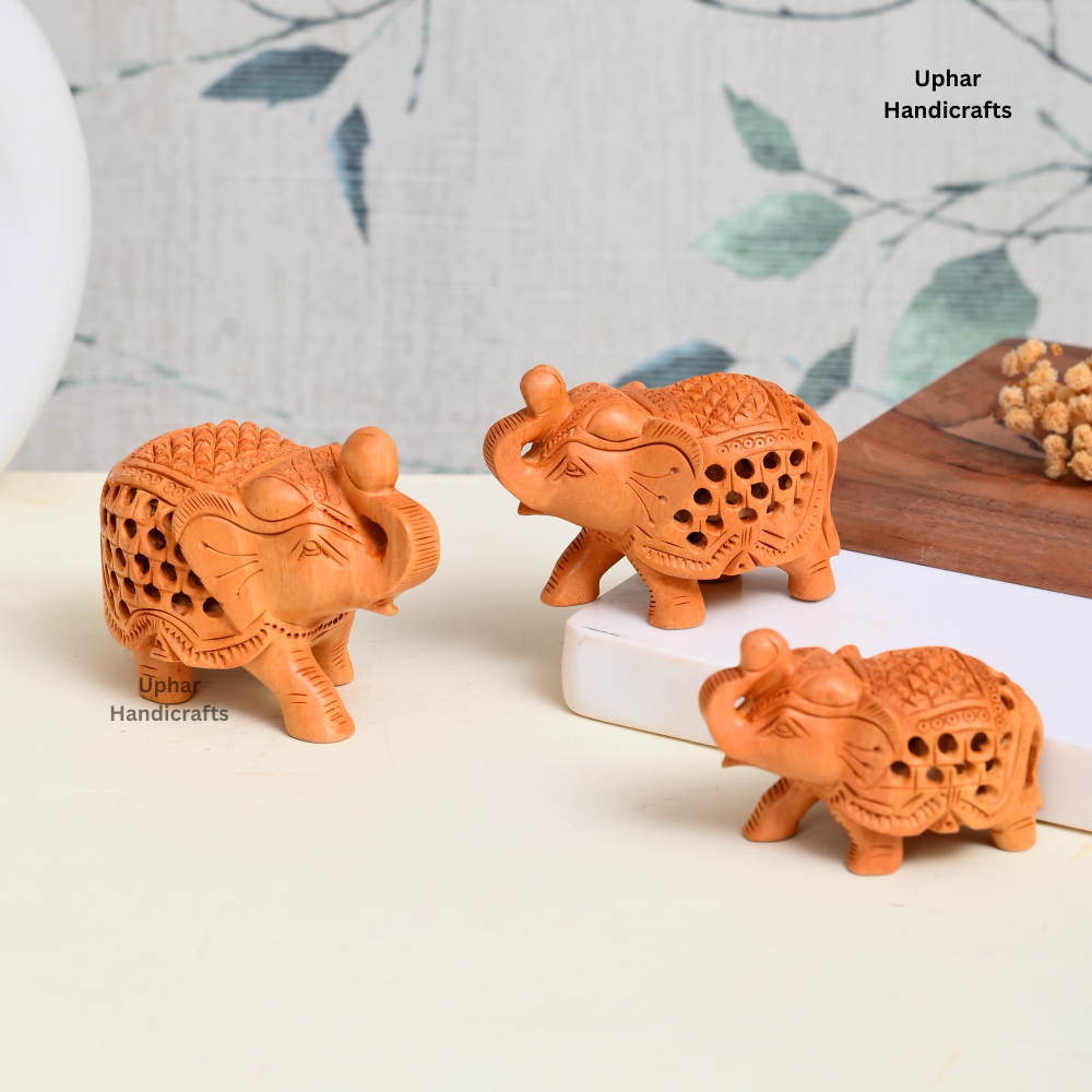 Set of 3 Wooden Elephant Figurines
Handcrafted Indian Jali Carved Elephants
Natural Wood Rajasthani Craft
3 Inch 2.5 Inch and 2 Inch Sizes
Boho Ethnic Bookshelf and Table Decor
Housewarming Diwali and Birthday Gift
Uphar Handicrafts