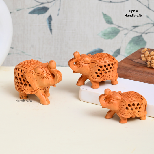 Set of 3 Wooden Elephant Figurines
Handcrafted Indian Jali Carved Elephants
Natural Wood Rajasthani Craft
3 Inch 2.5 Inch and 2 Inch Sizes
Boho Ethnic Bookshelf and Table Decor
Housewarming Diwali and Birthday Gift
Uphar Handicrafts