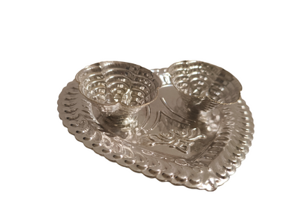 Silver Kumkum Chawal Holder Plate
German Silver Indian Pooja Accessory
Dual Bowl Roli and Rice Holder
Elegant Heart Pattern Embossed Design
Traditional Mandir and Festival Decor
Diwali Return Gift and Housewarming Gift
Uphar Handicrafts