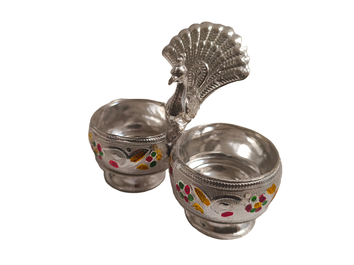 Silver Peacock Kumkum Rice Bowl
Traditional Indian Roli Chawal Holder
Metal Peacock Puja Decoration
Embossed Floral Enamel Design
Wedding Thali and Temple Accessory
Spiritual Return Gift for Festivals
Uphar Handicrafts