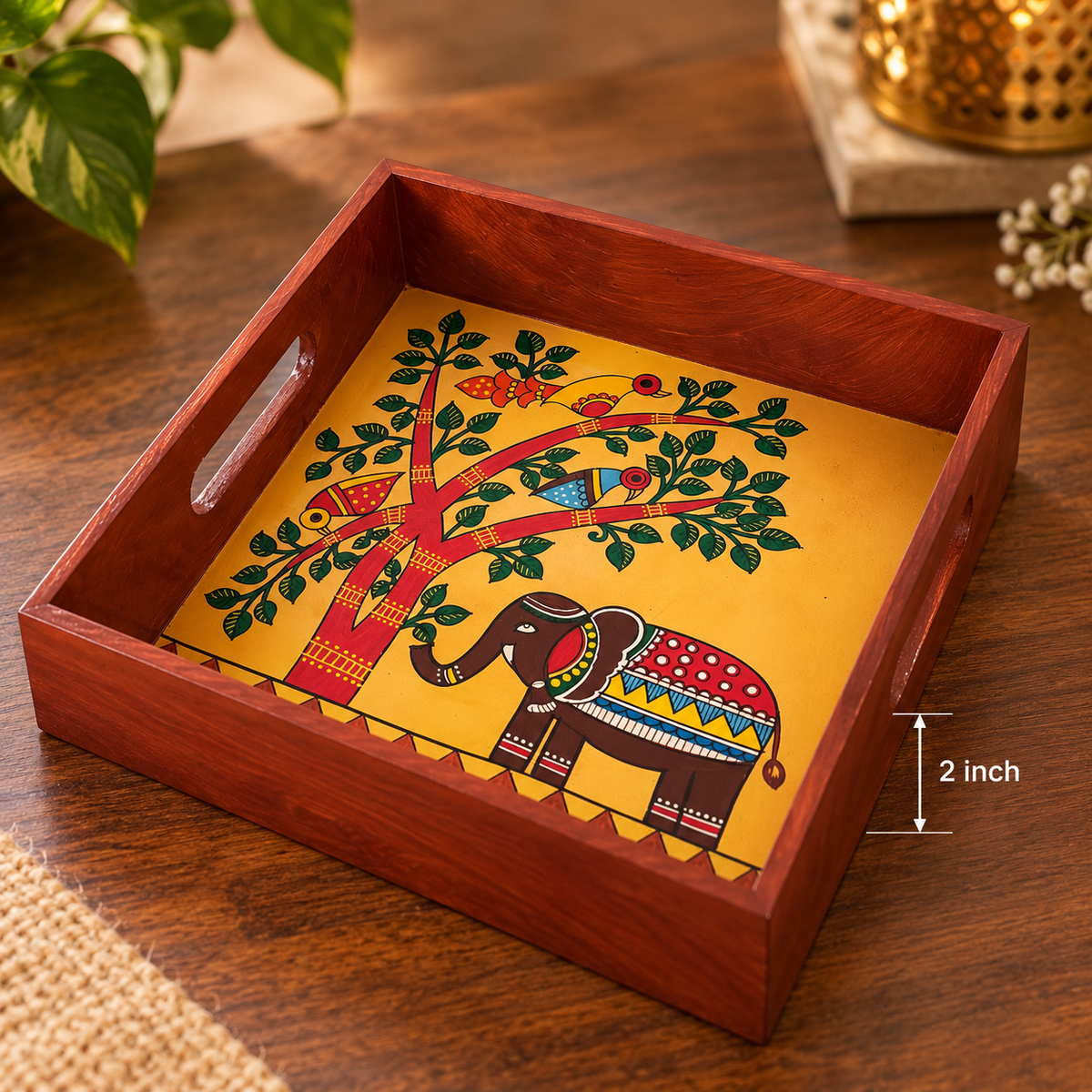 Square wooden serving tray with a hand-painted elephant motif
Central folk art design featuring an elephant and tree
Polished wooden frame with convenient cut-out side handles
Handcrafted tray measuring approximately 8 inches long and wide
Suitable for serving tea, snacks, dry fruits and sweets
Indian-inspired decorative tray for everyday use and special occasions
Uphar Handicrafts
