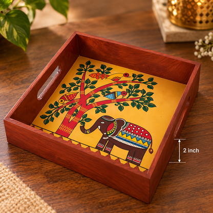 Square wooden serving tray with a hand-painted elephant motif
Central folk art design featuring an elephant and tree
Polished wooden frame with convenient cut-out side handles
Handcrafted tray measuring approximately 8 inches long and wide
Suitable for serving tea, snacks, dry fruits and sweets
Indian-inspired decorative tray for everyday use and special occasions
Uphar Handicrafts