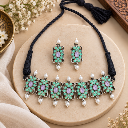 Traditional oxidized necklace and earrings set
Indian-inspired jewelry with antique silver-tone finish
Handcrafted necklace with matching earrings
Decorative stones and beads on traditional jewelry
Suitable for weddings, festivals and celebrations
Ethnic jewelry set for traditional outfits
Uphar Handicrafts