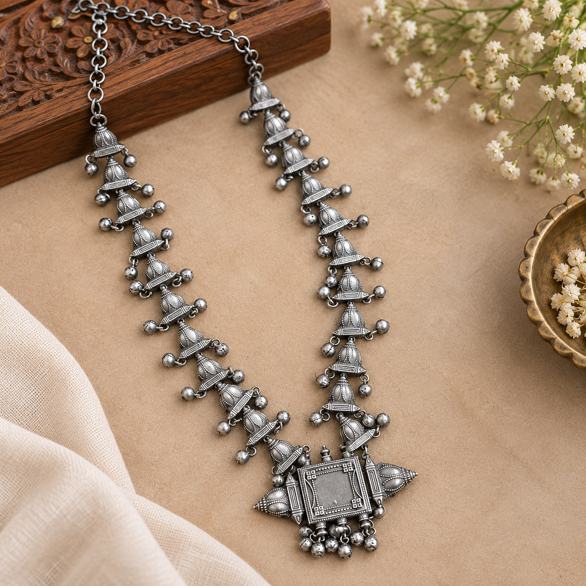 Traditional silver-tone oxidized jewelry set
Handcrafted necklace and matching earrings
Indian-inspired tribal and boho style
Metal alloy design with decorative stones
Bead accents add detail to the necklace set
Suitable for weddings, festivals and parties
Uphar Handicrafts