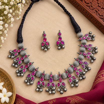 Traditional tribal oxidized necklace and earrings
Indian-inspired handcrafted jewelry set
Antique silver-tone metal alloy finish
Decorative stone and bead accents
Matching earrings complement the necklace design
Suitable for Garba, Navratri and festive occasions
Uphar Handicrafts