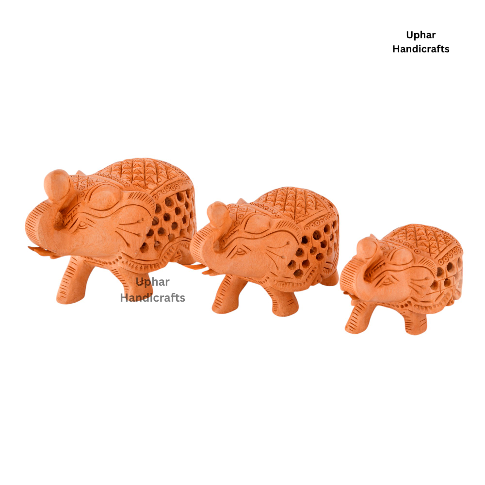 Wooden Jali Elephant Showpieces
Set of 3 Traditional Indian Elephants
Intricate Lattice Carved Wood Design
Natural Finish Rajasthani Handicraft
Spiritual Altar and Entryway Decoration
Compact Boho Home and Office Decor
Uphar Handicrafts